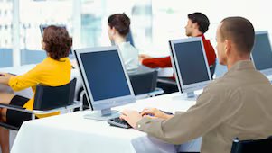 Employees using computers in an office