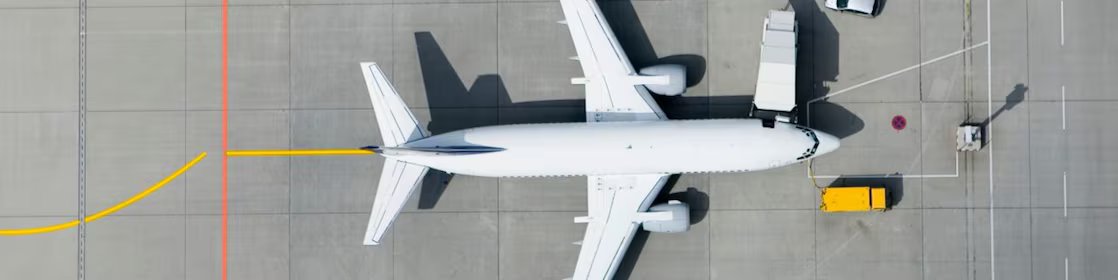 Aerial view of airplane and vans