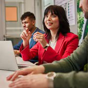 Eurasian female employee leading a team discussion